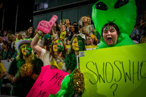 Phi Mu showing their school cheer at the pep rally